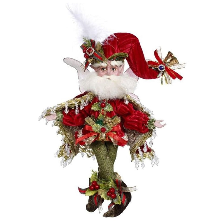 bearded fairy wearing red top and hat, green pants, and a red and gold cape, all with holly accents.