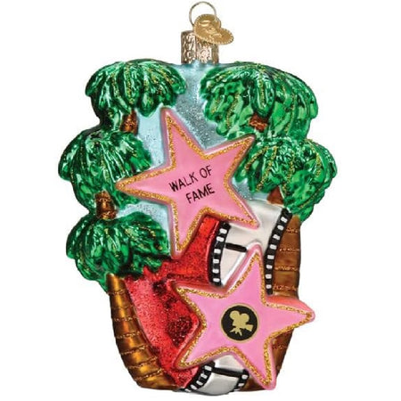 blown glass ornament featuring palm trees, movie reel and pink hollywood walk of fame stars.