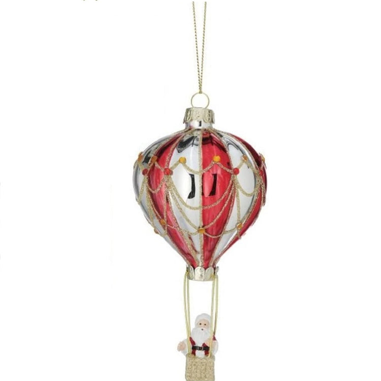 hot air balloon shaped ornament in gold and red stripes. Santa waving from a gold basket.