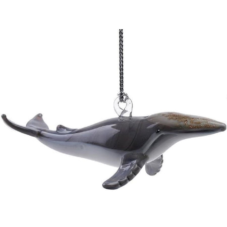 Hanging glass ornament shaped like a humpback whale.  Grey with brown glitter like accent on top.