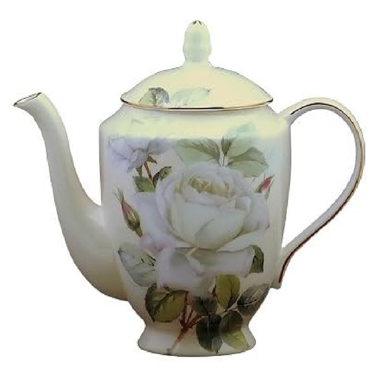 cream color teapot with gold trim, there is an image of a white rose on it as well.