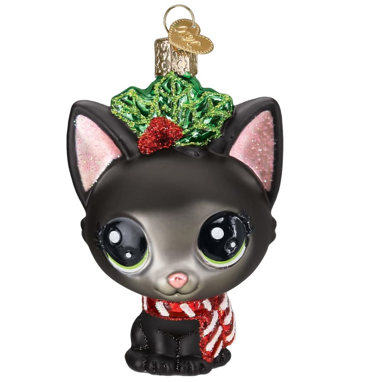 blown glass black kitten ornament, wearing a red and white striped scarf, with holly on her head.