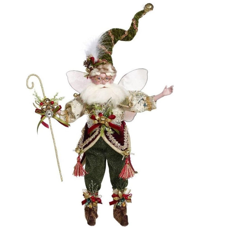bearded fairy wearing green pants, green stocking cap with jingle bell. Holding a hooked staff with jingle bells.