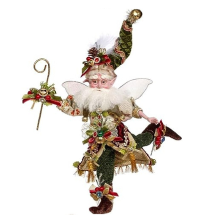 Decorative fairy figure with green stocking cap and white beard on a white background