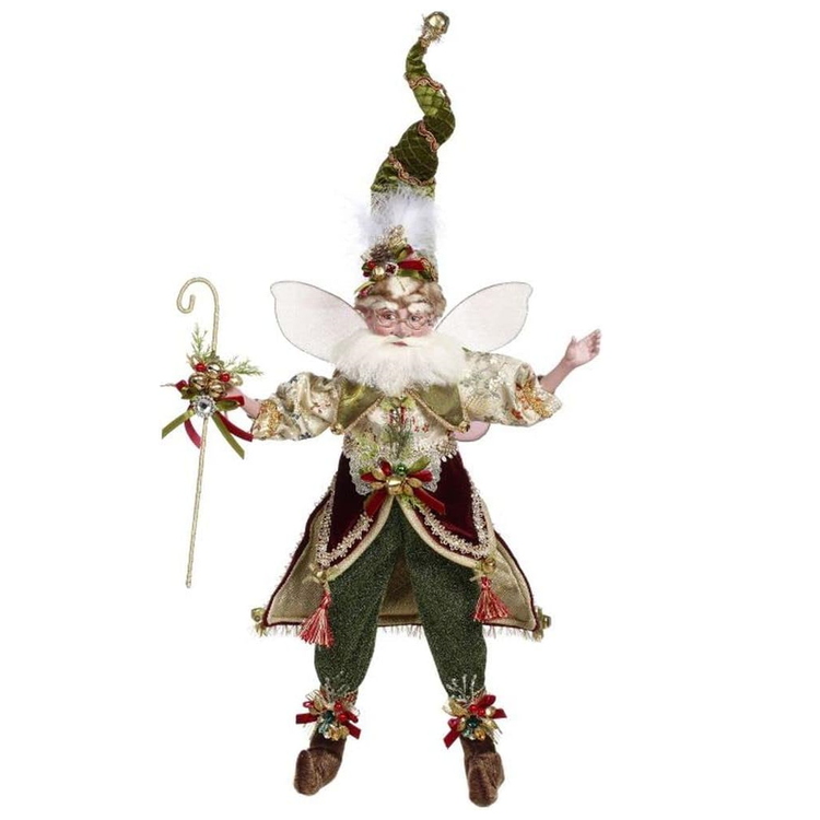 bearded fairy wearing cream shirt with green and burgundy accents, green pants and matching stocking cap. Holding a staff with bells.