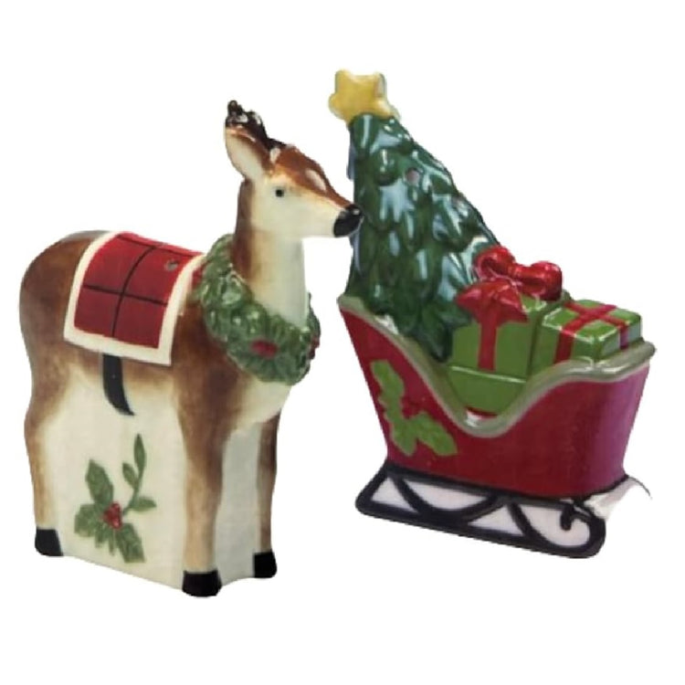 A set of ceramic salt and pepper shakers, one is shaped like a reindeer with a wreath around its neck, the other like a sleigh with gifts and a Christmas tree.