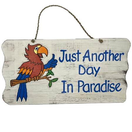 rough painted off white sign with a parrot on a branch and text: Just Another Day in Paradise. Rope Hanger