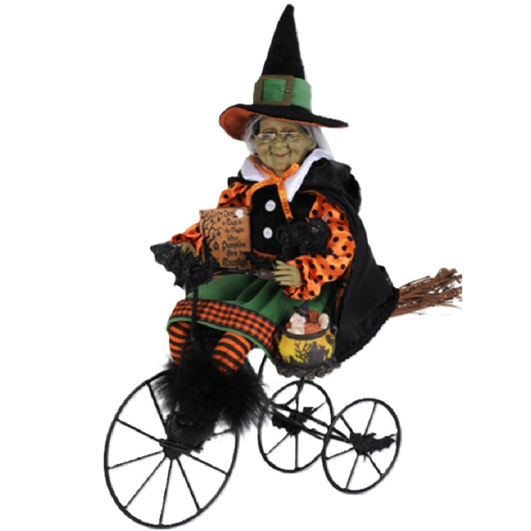 Karen Didion Margaret's Biking Venture 18-inch Halloween witch figurine riding a vintage-style tricycle with a black cat, pumpkin cauldron, and Trick or Treat sign.