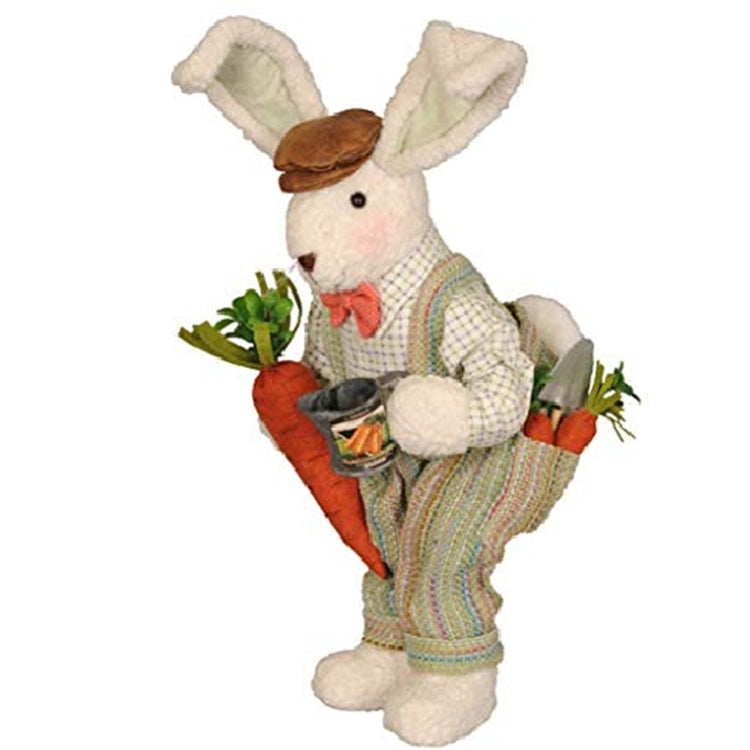 standing bunny figure with muted color striped pants, gardening tools and carrots in back pocket and holding a watering can and carrot. Brown cap