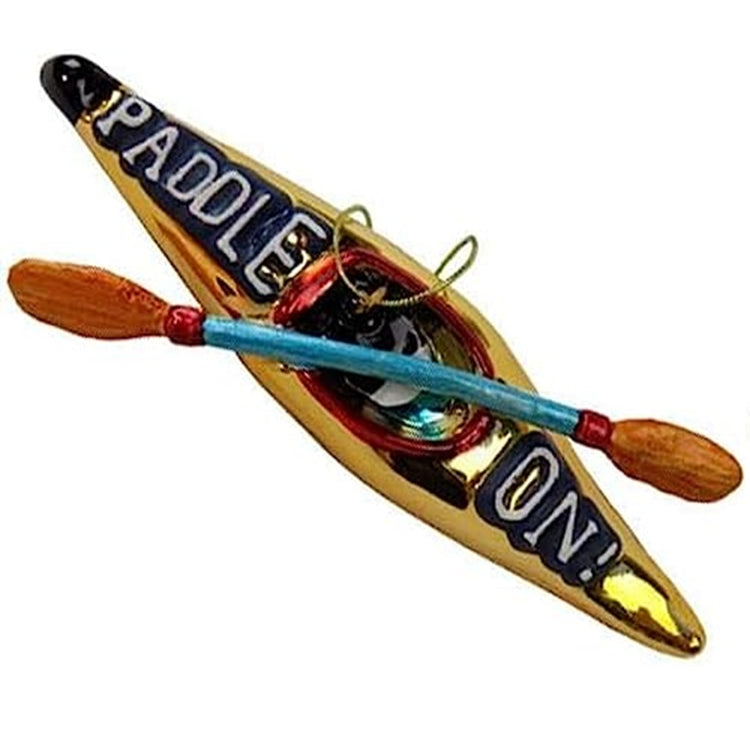 gold kayak shaped ornament with an oar and the text "Paddle On" paintd on top of the kayak.