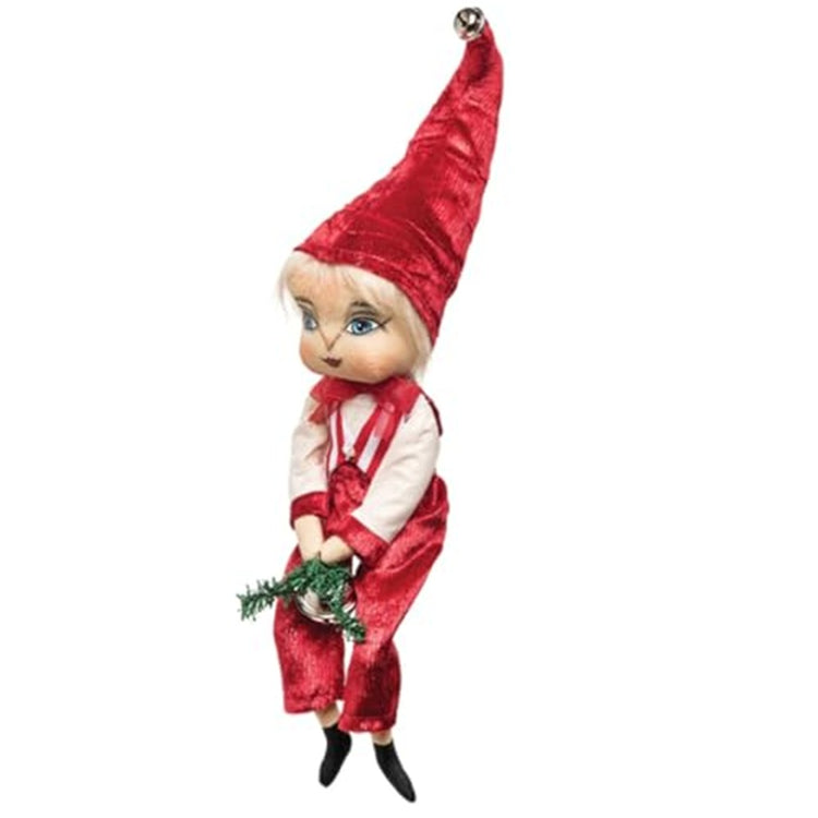 male figurine wearing red plants, matching tall pointy hat and an off white shirt with matching red trim. He holds some greenery and has a bell on the tip of his hat