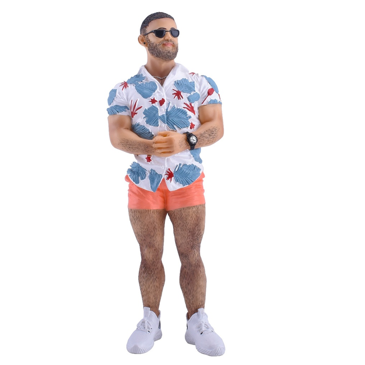 Figurine of man in short coral colored shorts, a blue and white hawaiian shirt and sun glasses.