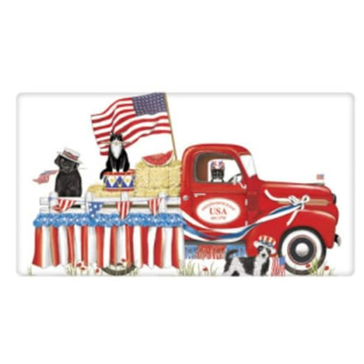 White kitchen dish towel with a red pickup truck with 2 dogs and 2 cats. Patriotic with flag bunting and a flag. Bales of hay.