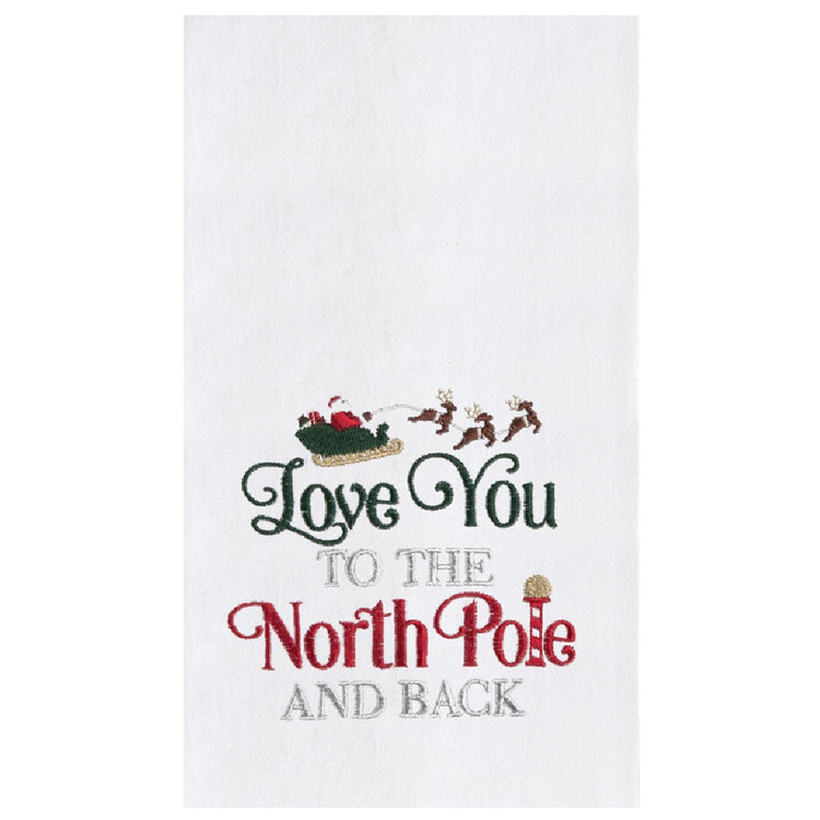 white towel features an embroidered design of Santa’s sleigh and reindeer flying over elegant script in traditional red, green, and silver