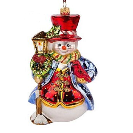 Stylishly dressed snowman next to lamp post, blown glass ornament.