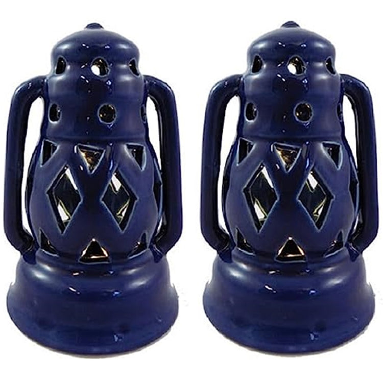 2 identical dark blue lantern lights with cut out shapes to let the LED lights shine through.
