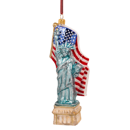 Blown glass ornament, statue of liberty with American flag behind her