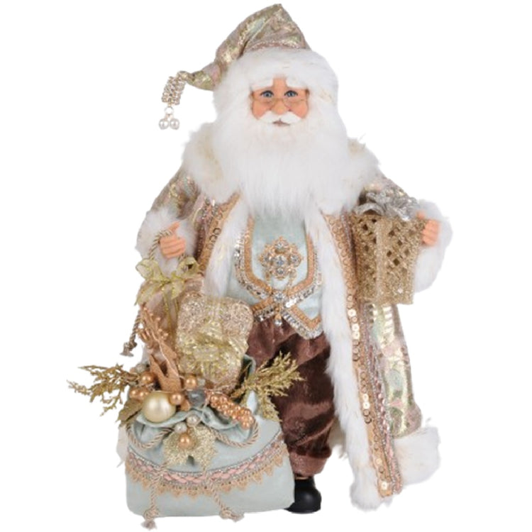 Standing Santa Figure wearing brown pants and a light green vest with a long coordinating coat with faux fur trim. White beard and matching hat. He carries a green bag with beads and ribbon and a gold package.