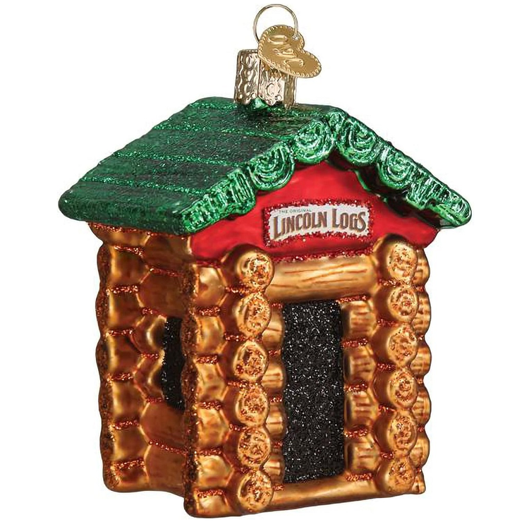 Blown glass ornament of a cabin made of lincoln logs