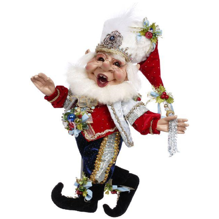 bearded elf figurine in red, blue and silver nutcracker inspired outfit.