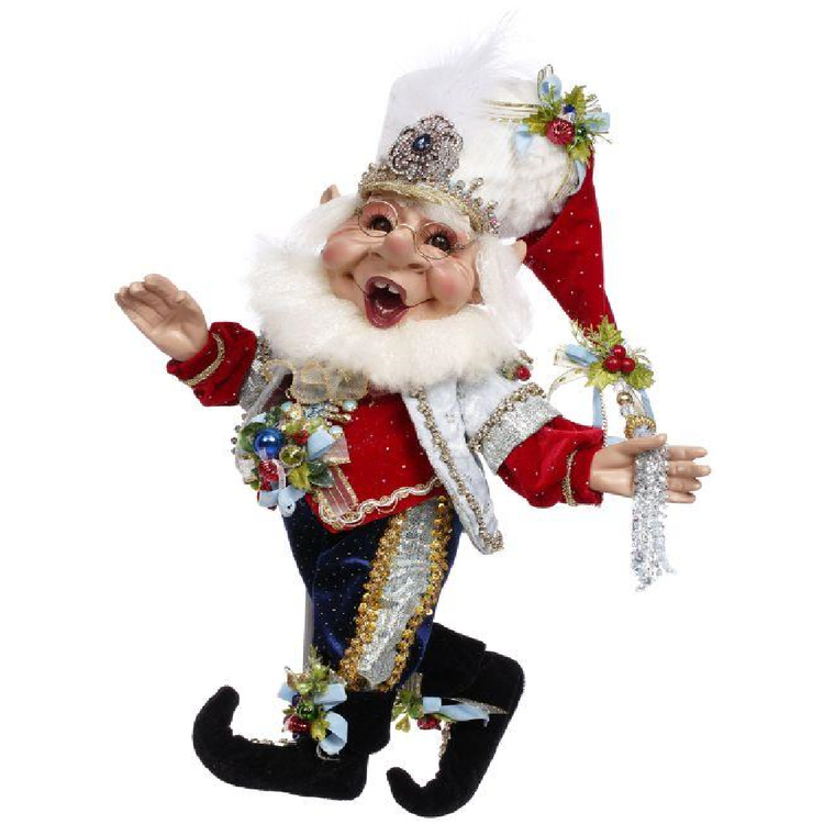 bearded elf figurine in red, blue and silver nutcracker inspired outfit.