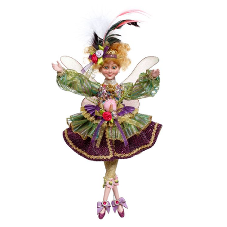 girl fairy in green and purple dress, adorned with sequins and ribbon, and a matching headband with feather.