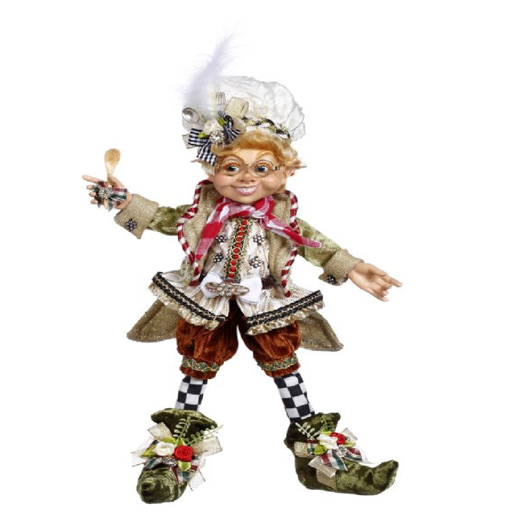 elfin boy wearing plaid stockings, gold vest and jacket and chefs hat, holding spoon.
