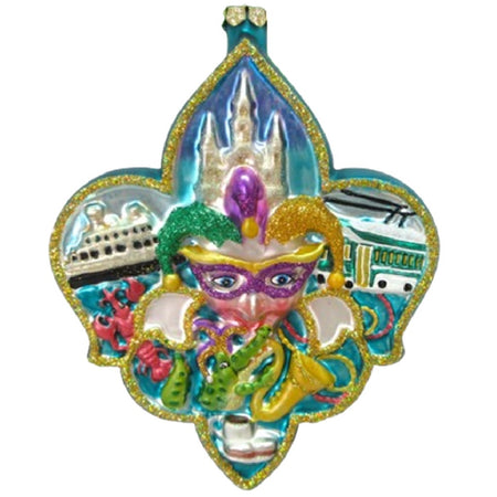 Fleur De Lis shaped ornament with a jester, ship, trollly castle and other symbols of Mardi Gras. Blue, purple green and gold with glitter accents