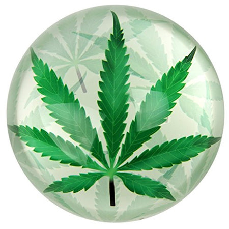 round domed paperweight with image of green marijuana leaf