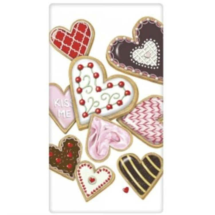 white kitchen towel with graphics of heart shaped cookies decorated for Valentines Day