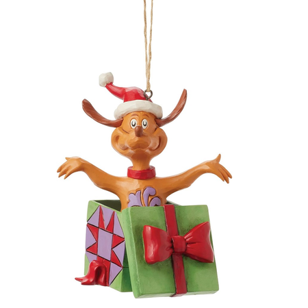Christmas ornament of a cartoon Max the Dog with a gift box on a white background