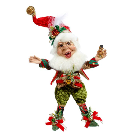 Bearded elf in red stocking cap, green velvet pants and holding a small bear.