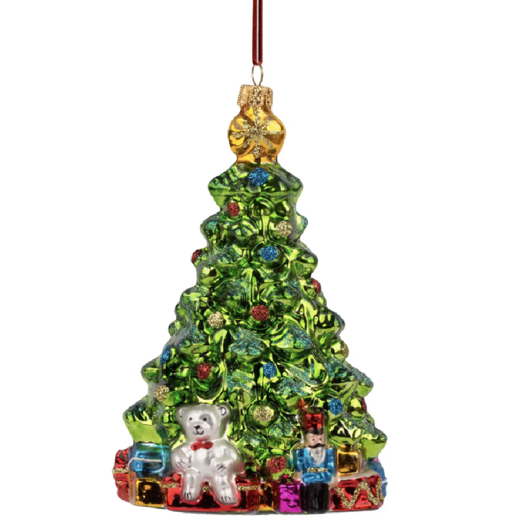 Blown glass christmas tree ornament with gifts and toys and the base.