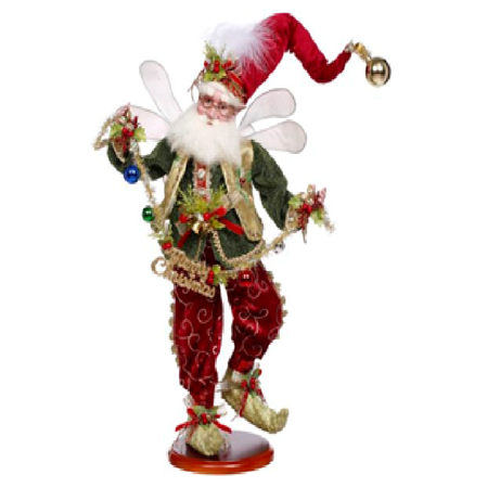Decorative fairy figure with red and green attire on a white background