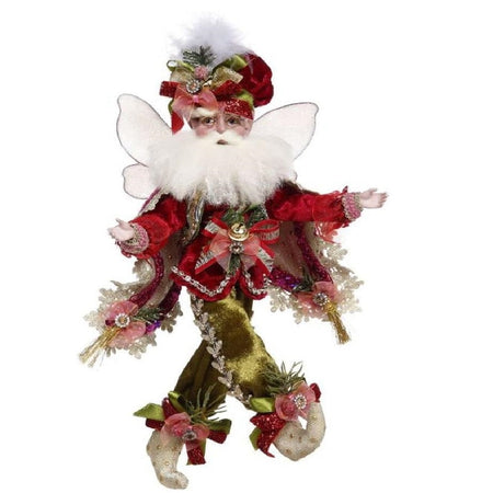 bearded fairy in red coat, matching hat and a lace trimmed cloak. lots of ribbon and pine sprig adornments.