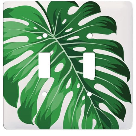 white double toggle switch plate with green monstera leaf design