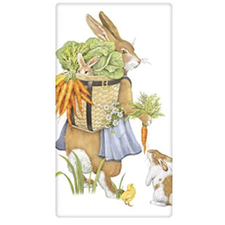 White kitchen towel with mother rabbit carrying vegetables and a baby rabbit in a basket on her back, another rabbit and chick at her feet.