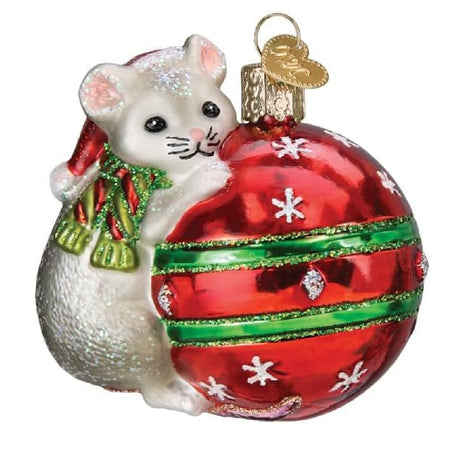 blown glass ornament of a mouse in a scarf, playing with a red and green ball ornament.