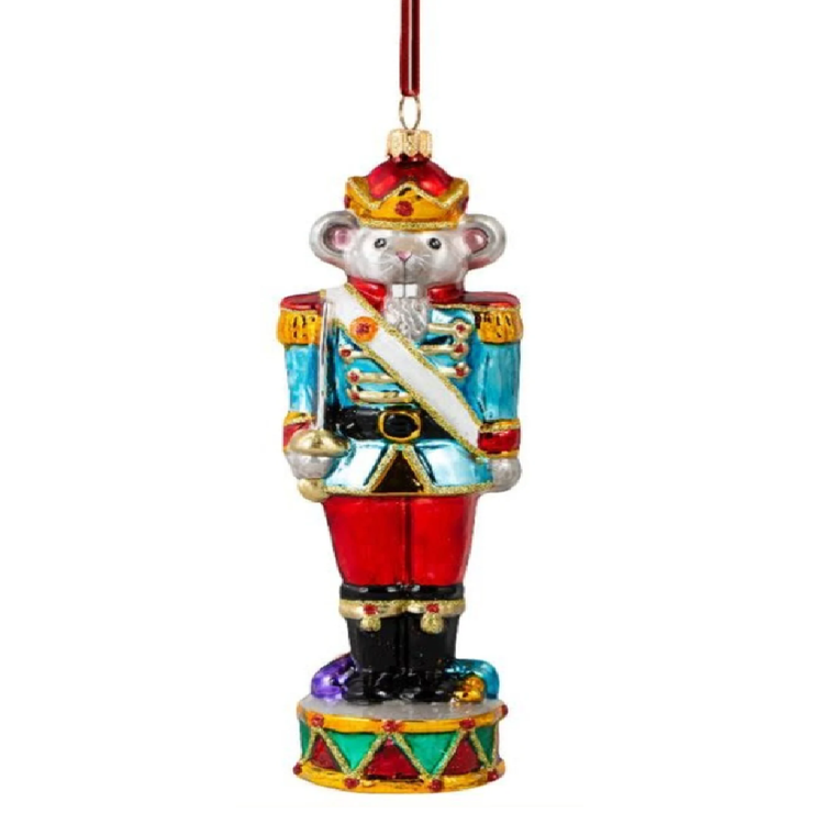 A colorful nutcracker soldier Christmas ornament featuring a gray bear dressed in a blue, red, and gold military uniform with a red crown and a hanging ribbon at the top, shown against a plain white background.
