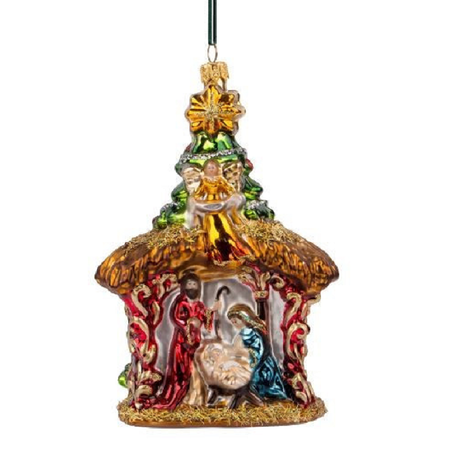 A colorful glass nativity ornament shaped like a thatched cottage with a hanging loop at the top, featuring a gold star, green tree, and figures in red, blue, and silver tones against a plain white background.