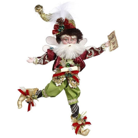 this bearded fairy has the naughty or nice list in hand. He's in a red jacket with green pants and a fur lined stocking cap.
