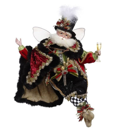 bearded fairy in black and red cloak, matching outfit with black checkered stockings. holding a glass of champagne.