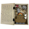 Bookshelf type book open and storing the peices:  Ark, 2 Doves, Noah, 2 Giraffes and 2 Elephants
