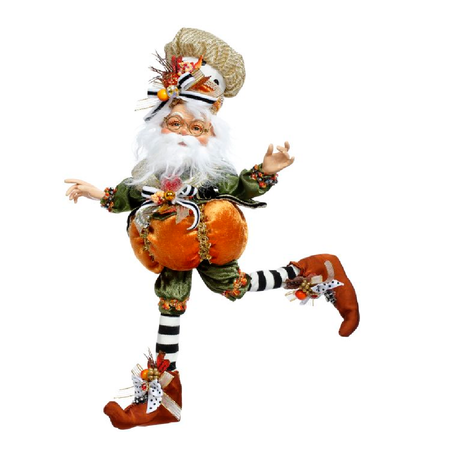 bearded elf wearing a pumpkin costume.