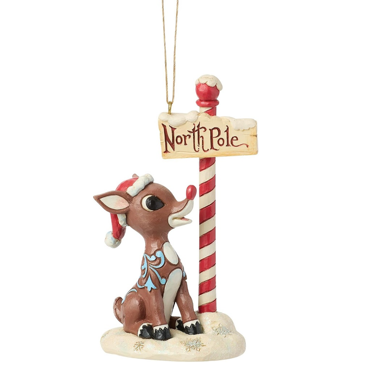 Christmas ornament of a reindeer with a 'North Pole' sign on a white background