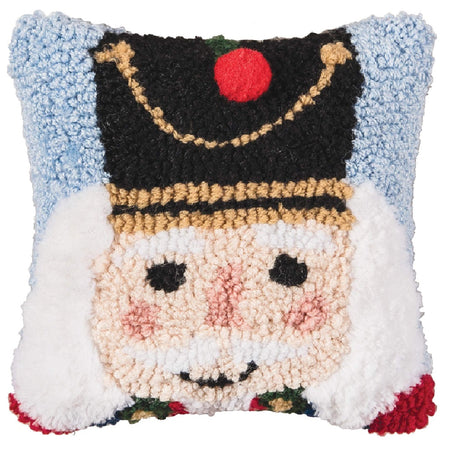 textrured acrylic pillow in light blue faturing a nutcracker face and hat
