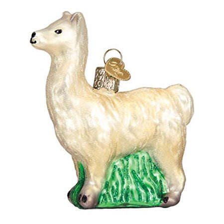 ornament shaped like a standing llama in white with green grass at his feet