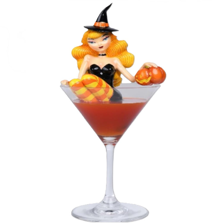 December Diamonds Orange Witch figurine displayed inside a decorative glass martini glass, 10 inches high