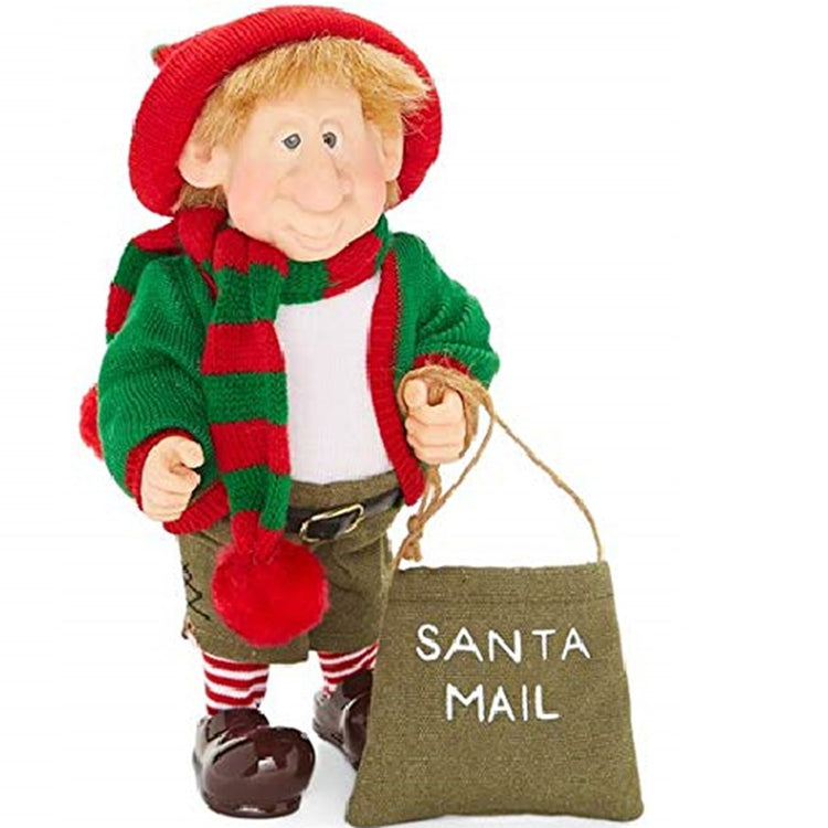 Standing elf figure wearing a green sweater, brown shorts and a green and red sweater with red hat. He carries a mail bag that says Santa Mail