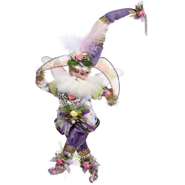 bearded fairy wearing light purple suit and matching stocking cap. He's holding a wired ribbon that is rainbow colors.